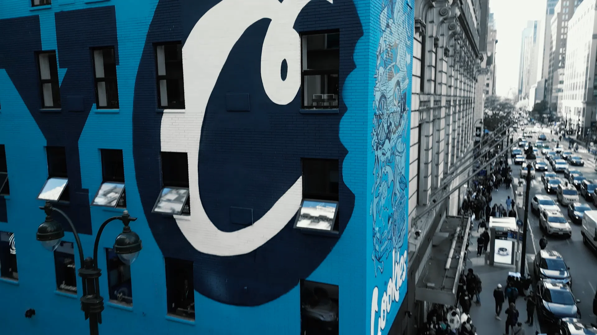 The crowd gathering outside the blue Cookies building in New York
